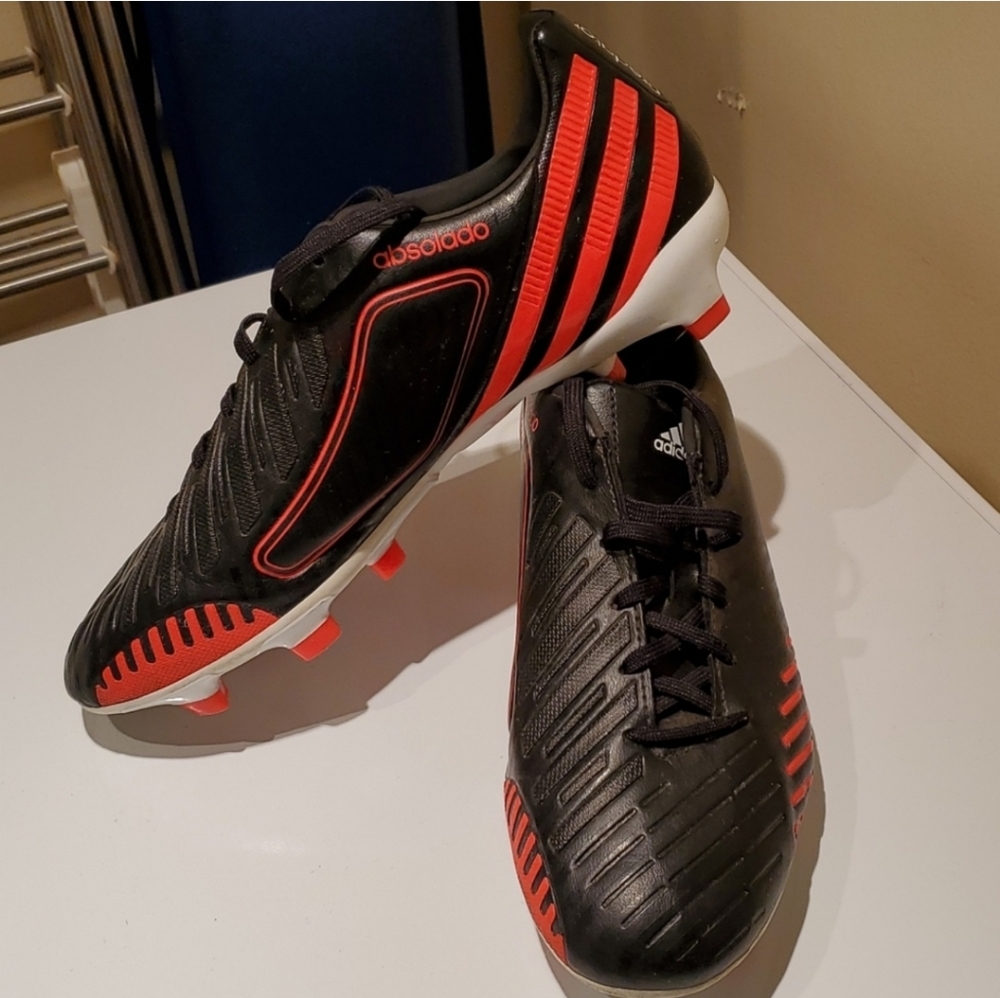 Adidas black and orange outdoor soccer shoes size 7.5